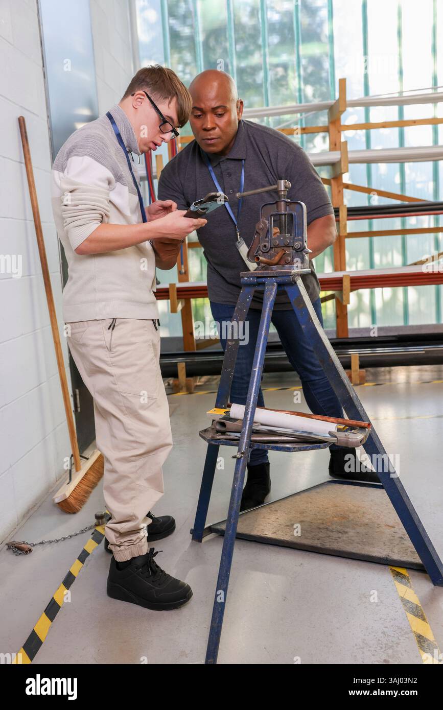 Disabled men working in workshop Stock Photo
