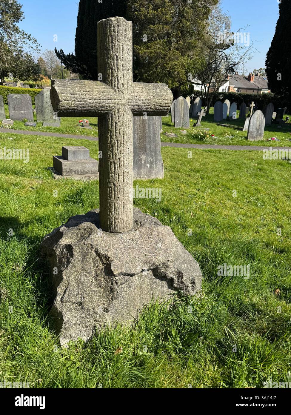 A simple stone cross in an English Churchyard Stock Photo - Alamy