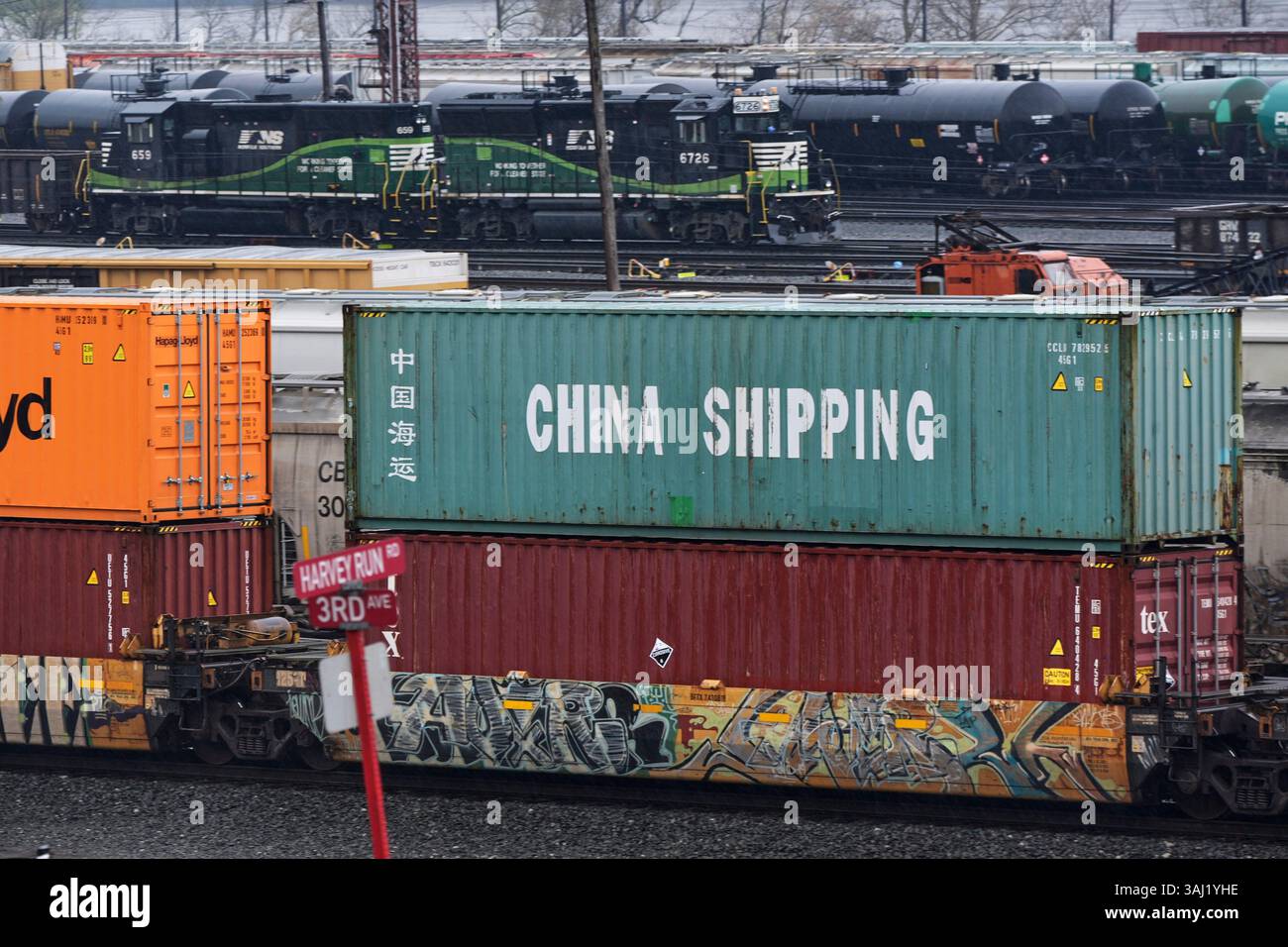 A Norfolk Southern freight pulling a consist of shipping containers ...
