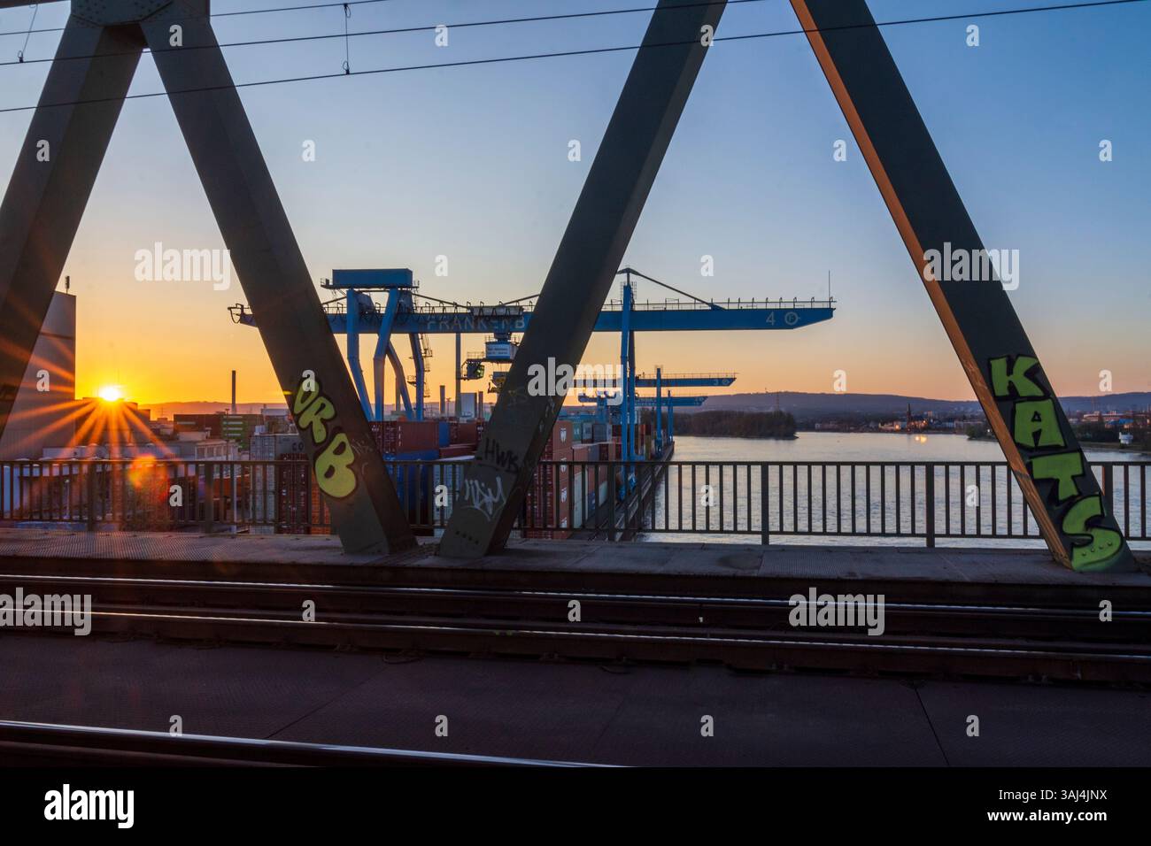 Mainz: river Rhein (Rhine), railway bridge Kaiserbrücke, container terminal port Ingelheimer Aue in Rheinhessen, Rheinland-Pfalz, Rhineland-Palatinate Stock Photo