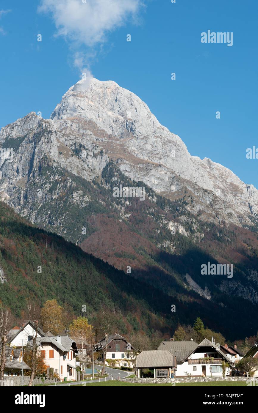 Scenic view of Log pod Mangartom with majestic mountain mangart, Julian alps peak in the background. Stock Photo