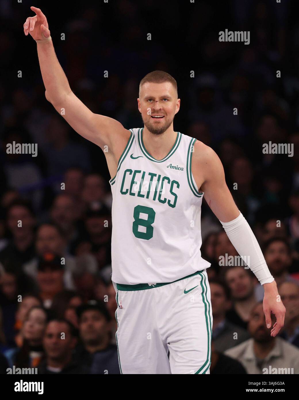 Boston Celtics' Kristaps Porzingis stands on the court during the