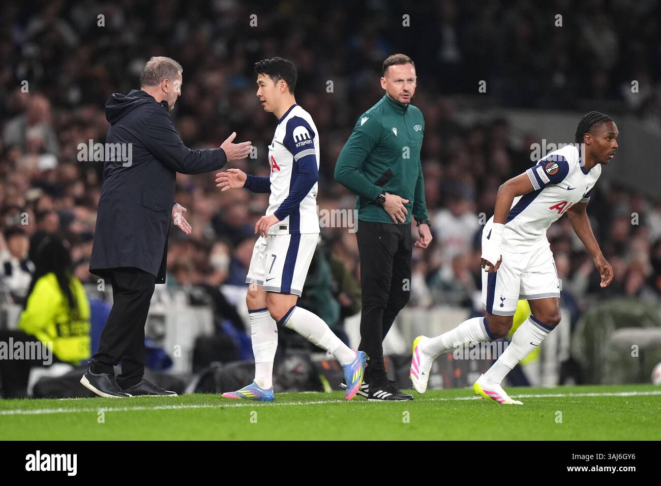 Tottenham Hotspur's Son Heung-Min (second left) is greeted by manager ...