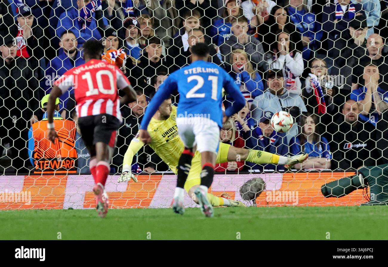 Rangers goalkeeper Liam Kelly saves a penalty during the UEFA Europa ...