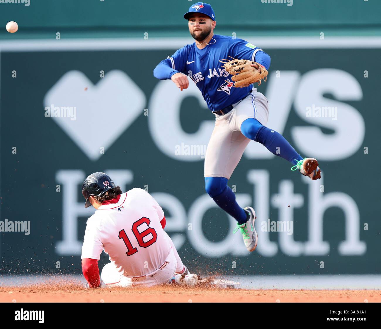 Toronto Blue Jays shortstop Bo Bichette, top, throws to first base over ...
