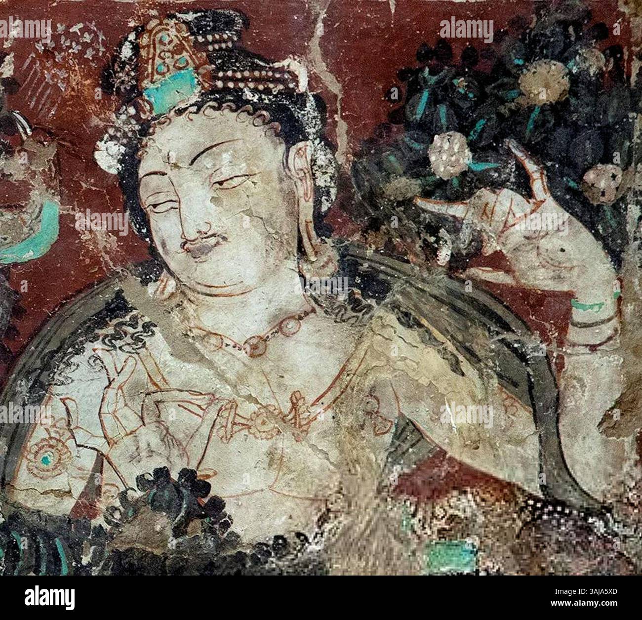 A detailed view of a Devata figure in the Cave of the Painters, Kizil ...