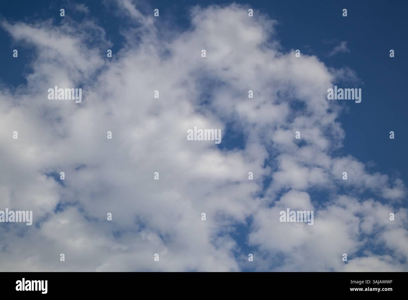 Blue sky with fluffy white clouds Stock Photo