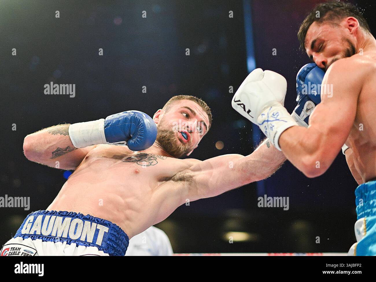 Alexandre Gaumont, left, lands a blow to Mathis Lourenco, right, during ...