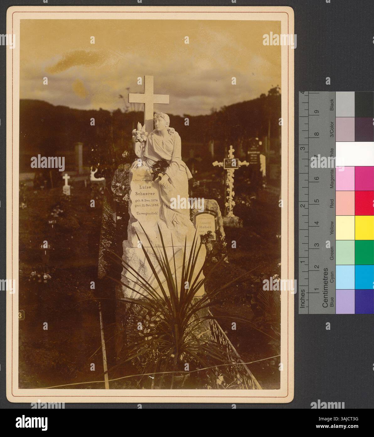 This 1896 photograph depicts a gravestone with a female sculpture ...