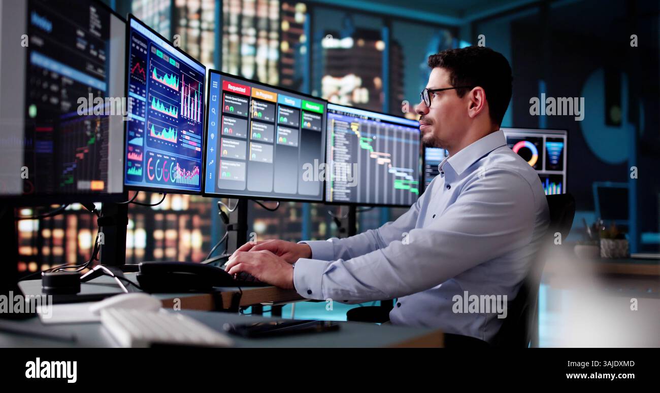 Scrum Project Manager Using Scrum Board Scheduling Software Stock Photo