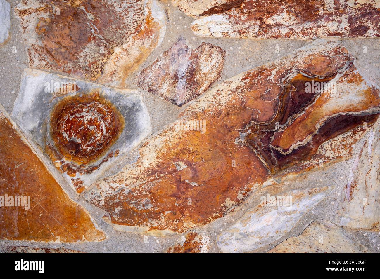 Textured Stone Wall Background, Irregularly shaped stones Stock Photo