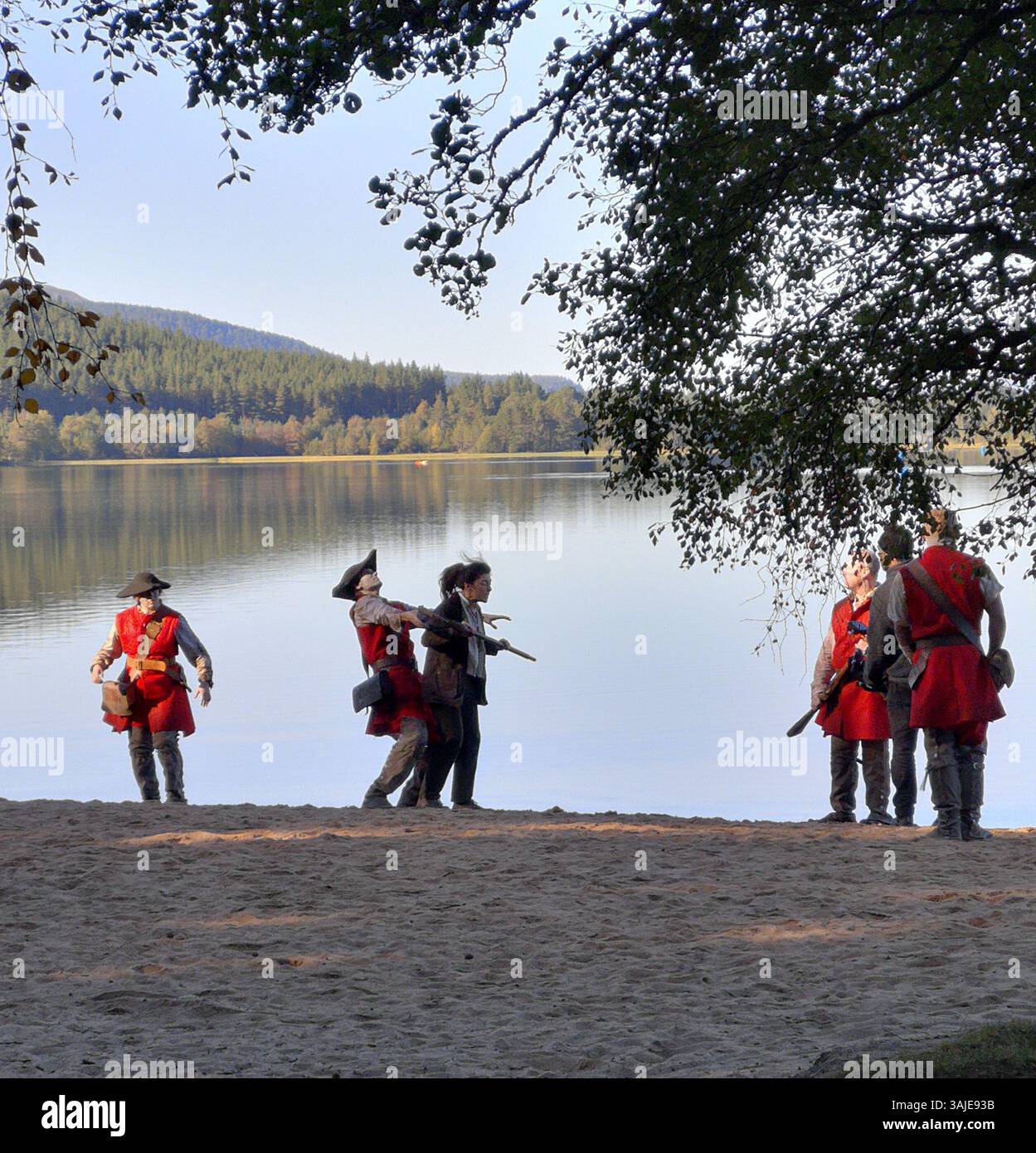 Red Coat English soldiers return to the shores of Loch Morlich near Aviemore Scotland. In reality it is actors on a film set. - Smartphone Captured Stock Image