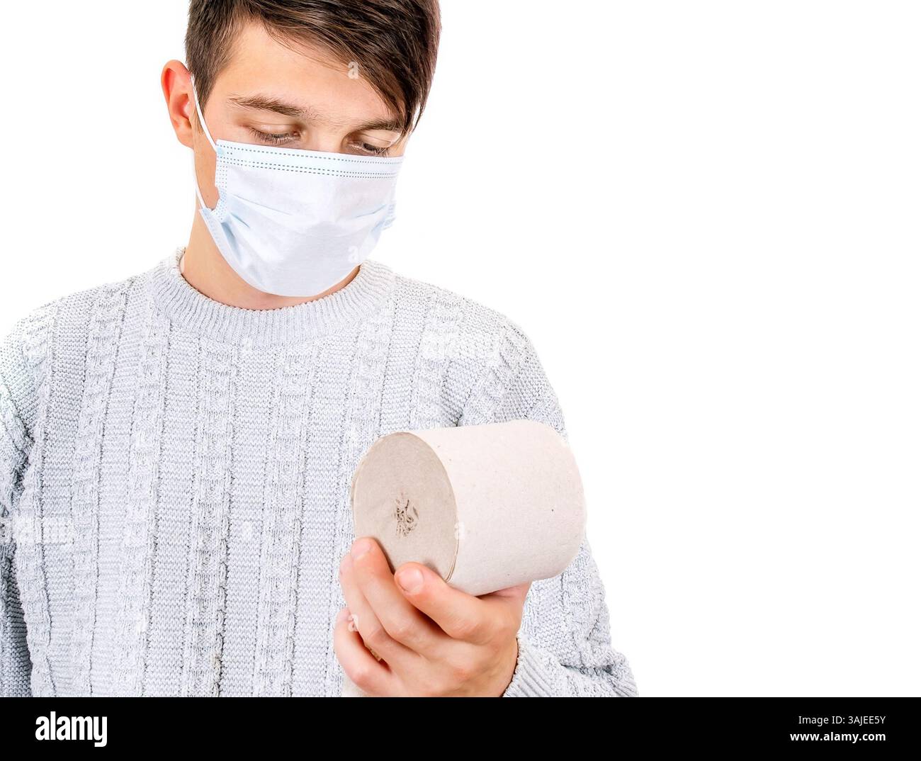 Young Man in Flu Mask with a Toilet Paper on the White Background closeup Stock Photo