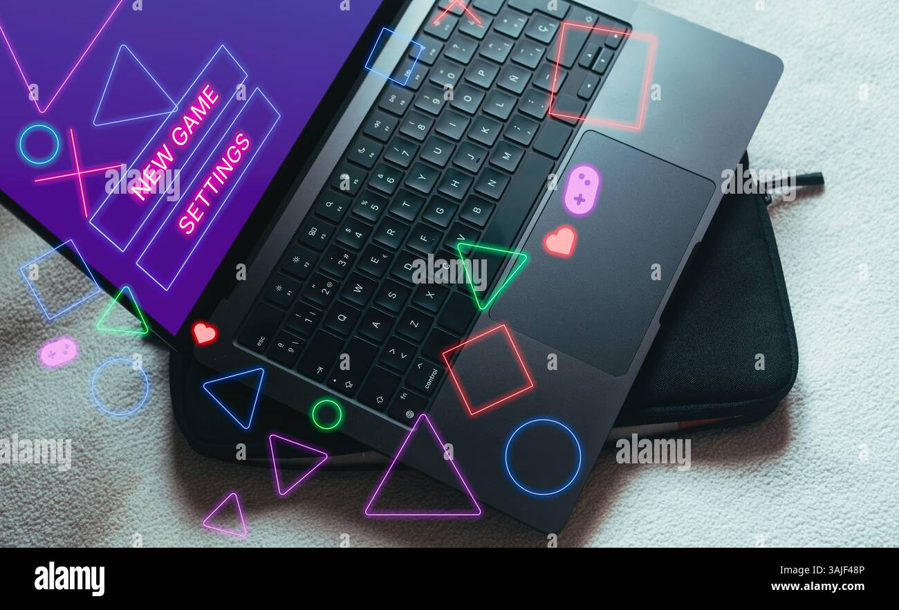 Laptop with gaming interface on screen. Playing online concept with empty space for text. Online entertainment and gamification. Stock Photo