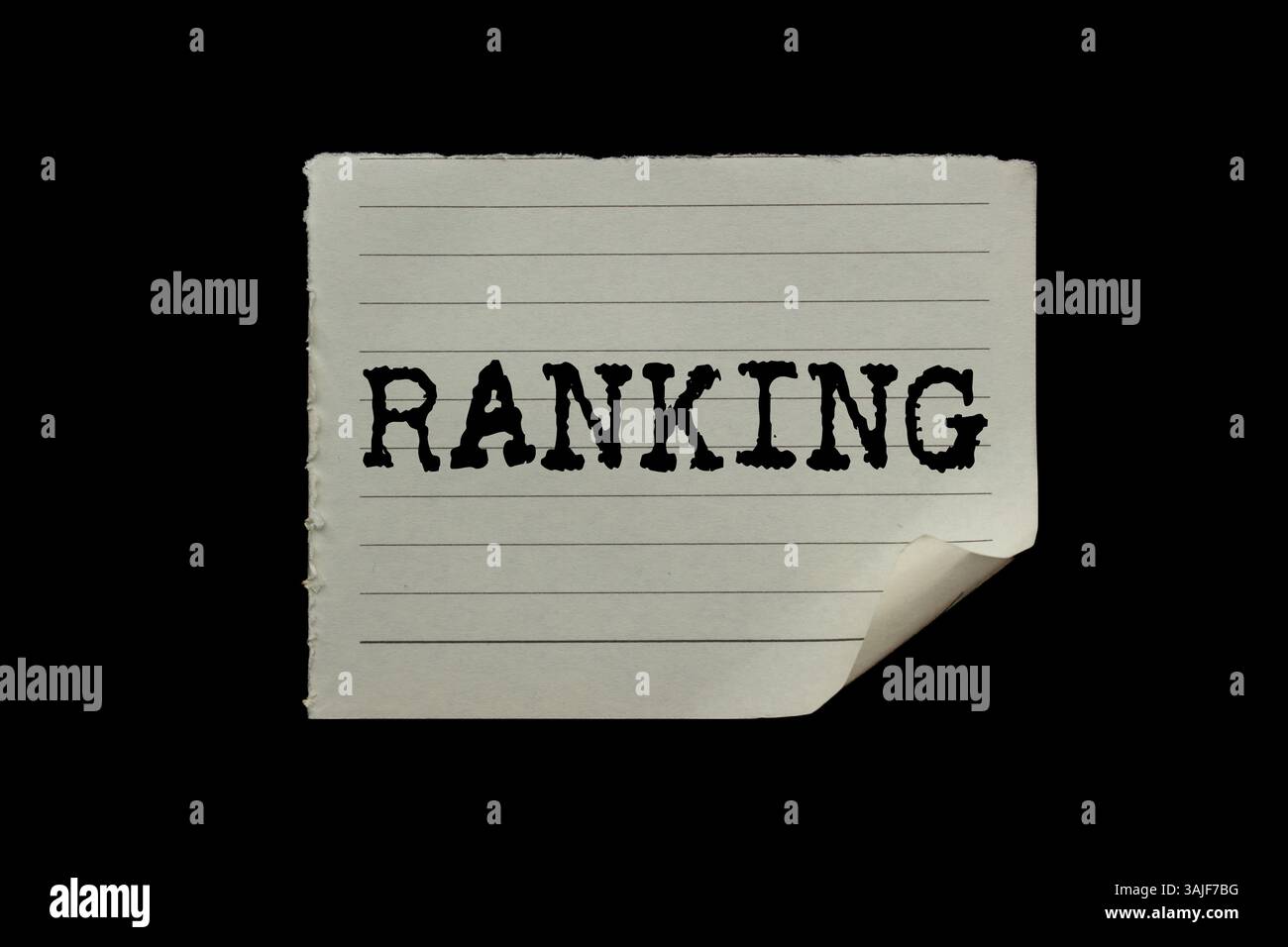 Ranking message written on ripped torn paper piece on black background ...