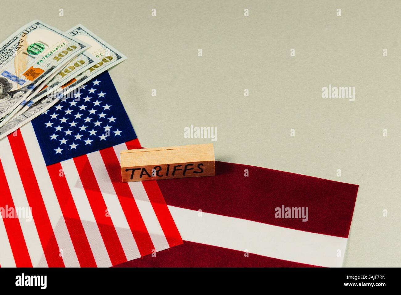 American flags are displayed alongside dollar bills and a block labeled ...