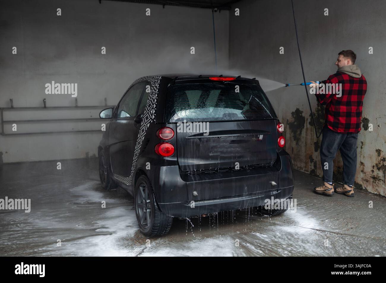 Washing rims at a manual car wash Stock Photo - Alamy