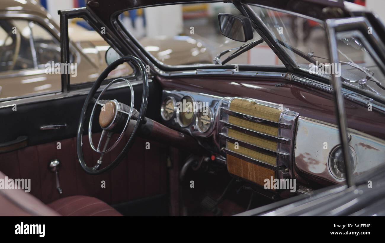 Interior view of vintage convertible car showing steering wheel and ...