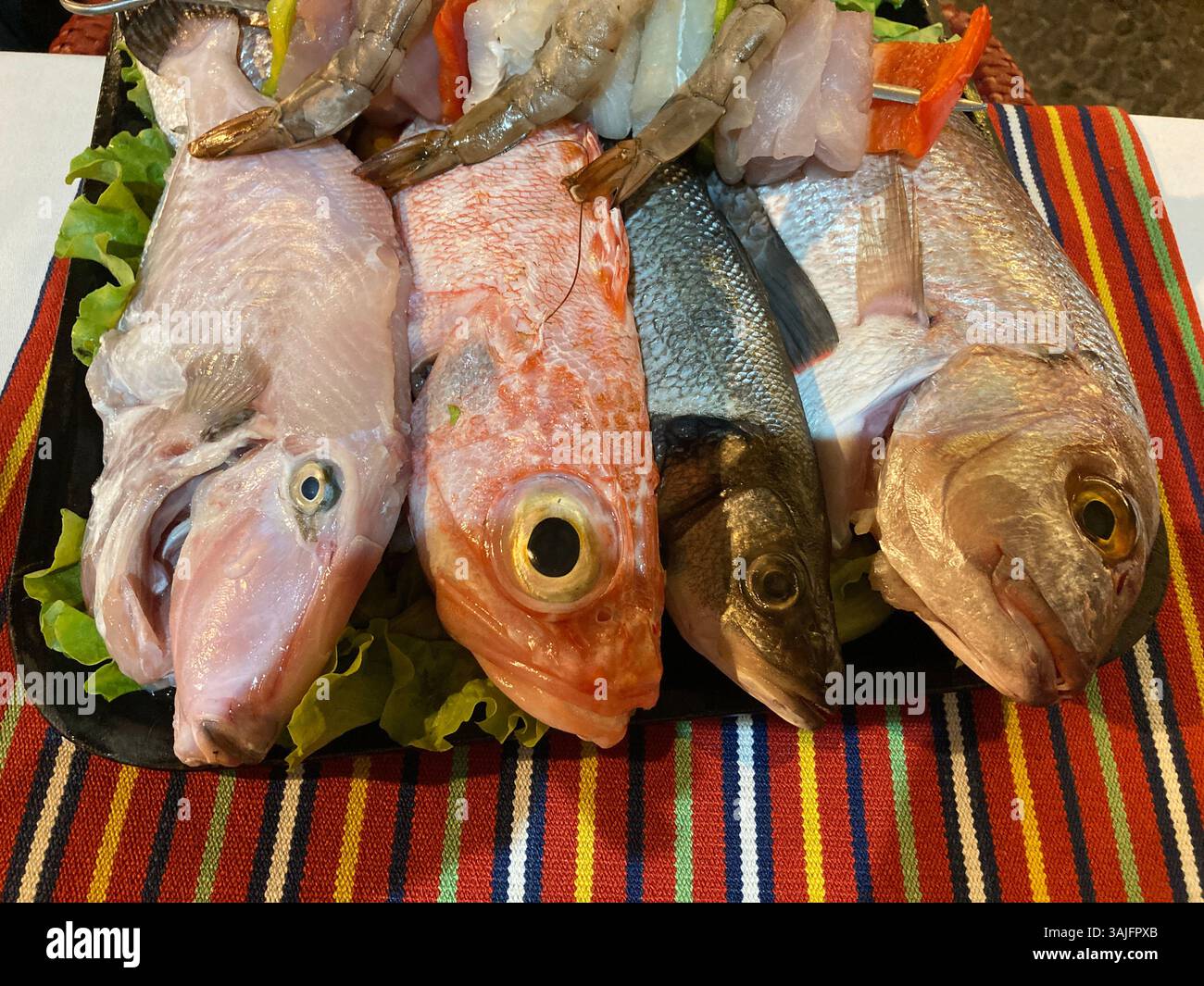 Freshly caught Atlantic fish on display in a restaurant in Madeira. - Smartphone Captured Stock Image