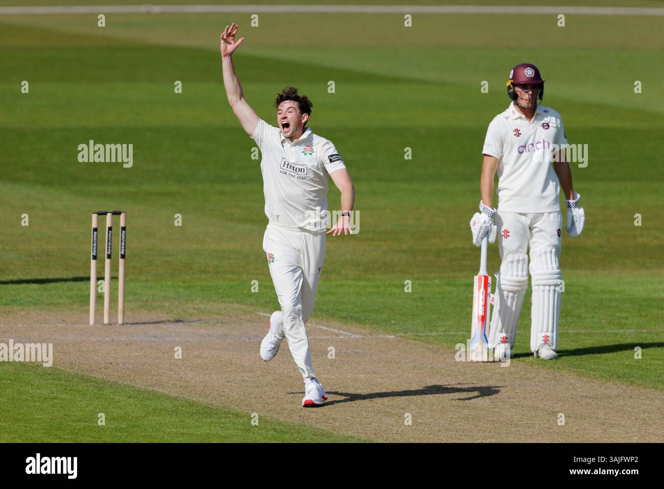 Lancashire's John Turner (left) celebrates tacking the wicket of ...