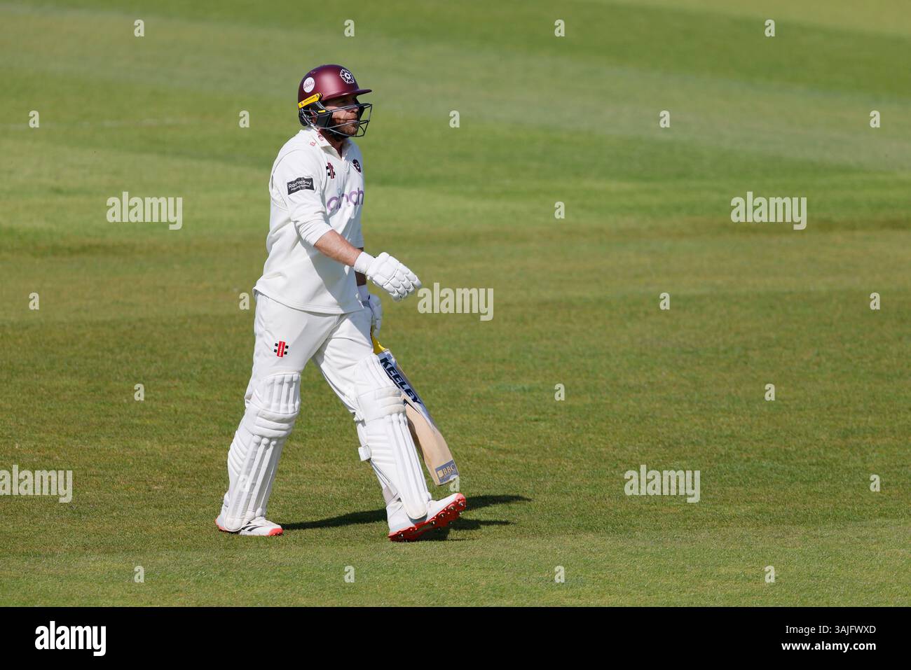 Northamptonshire's Luke Procter leaves the field after being bowled out ...