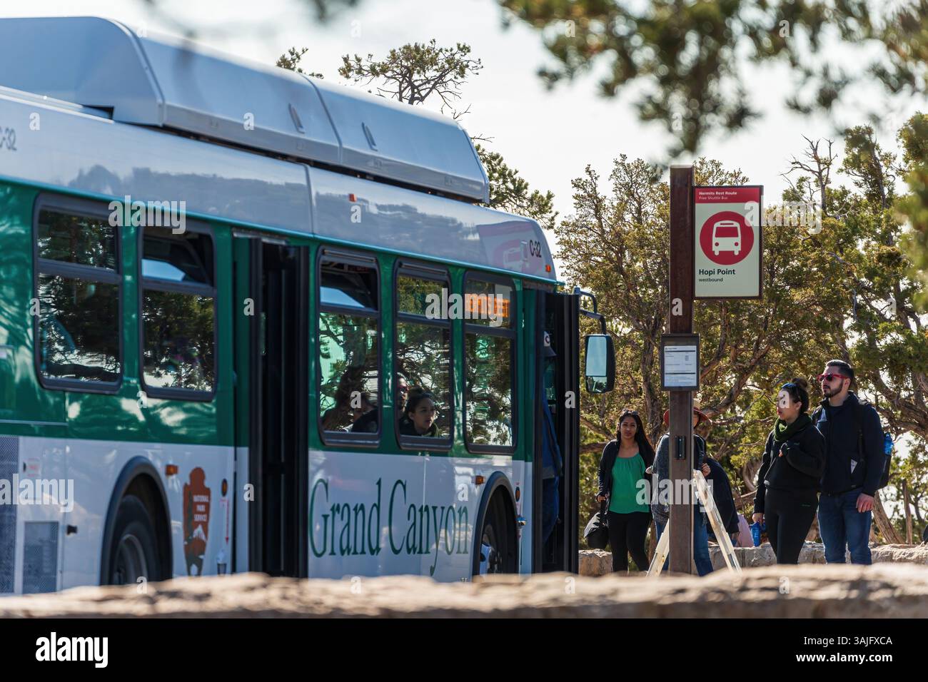 GRAND CANYON VILLAGE, USA - NOVEMBER 2019: Buses transporting tourists at the rim of Grand Canyon, USA Stock Photo