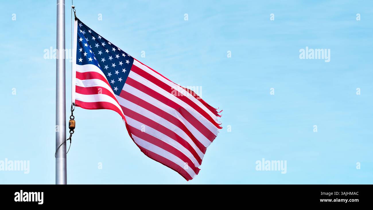 Us flag against a blue sky hi-res stock photography and images - Alamy