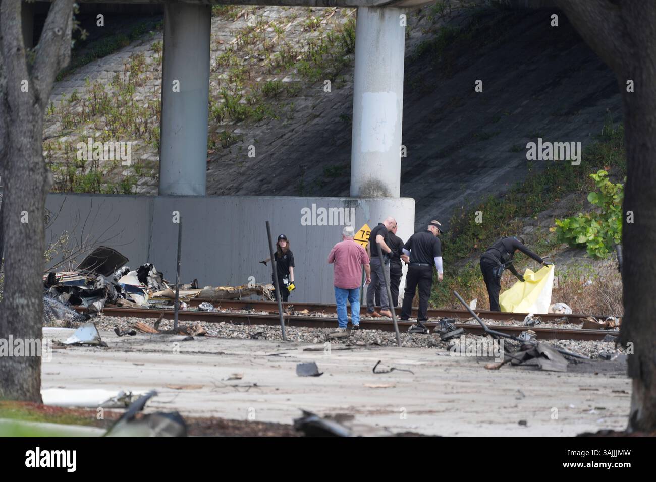 Emergency personnel respond to the area where a small plane crashed on ...