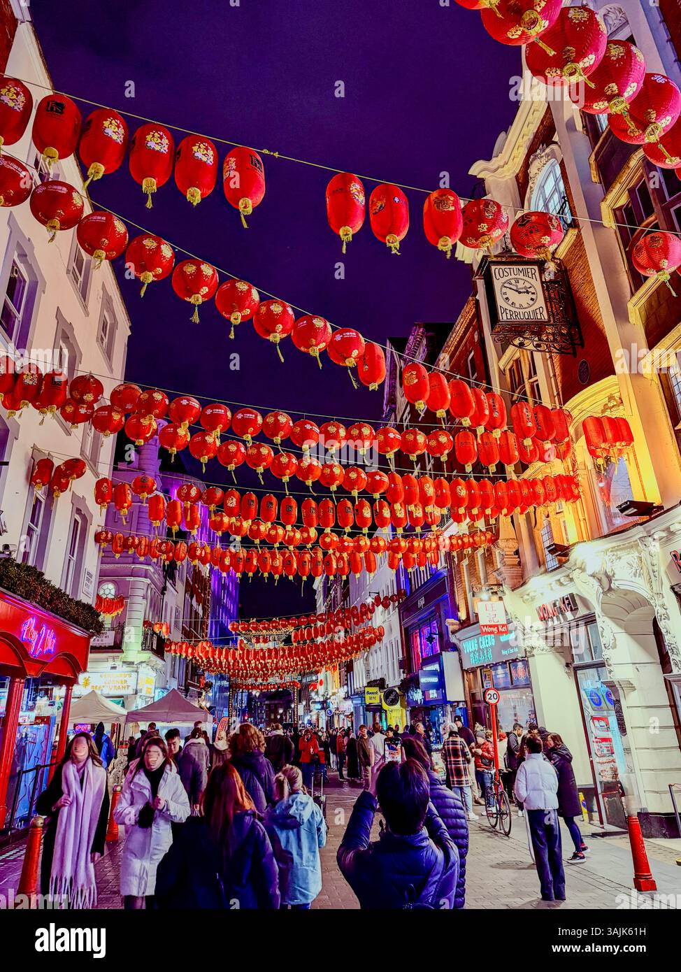 Chinatown London in winter is pure magic! The glowing red lanterns, bustling streets, and the scent of sizzling dishes. Stock Photo
