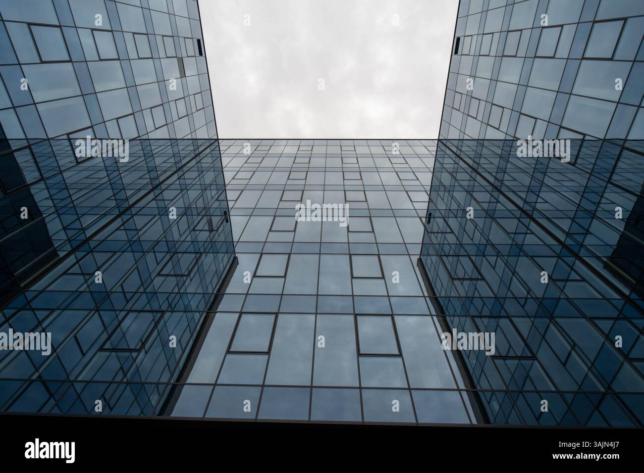 Modern Building with Glass Facades Reflecting the Sky Stock Photo - Alamy