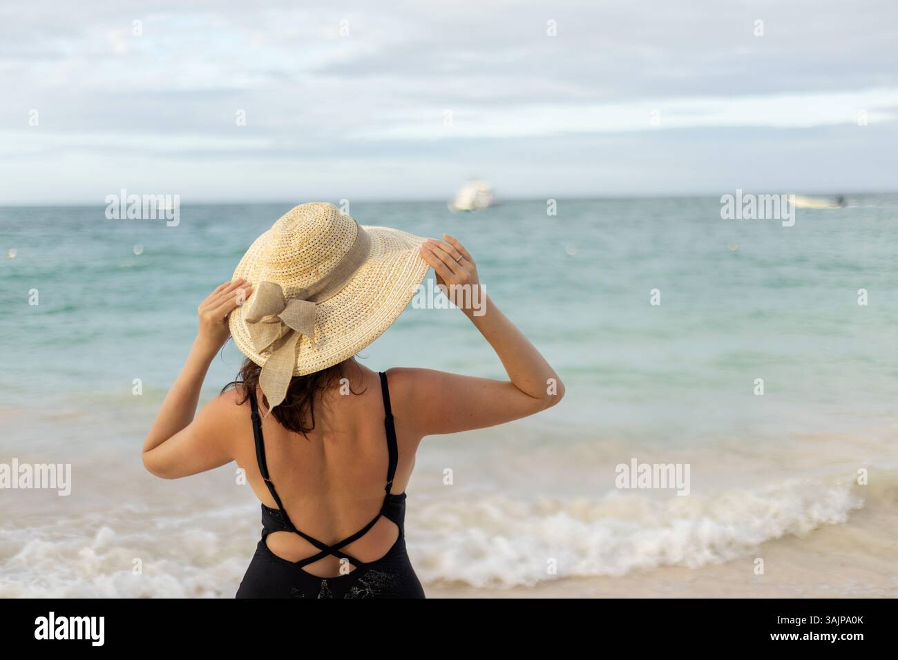 Woman stands beach wearing stylish hi-res stock photography and images ...