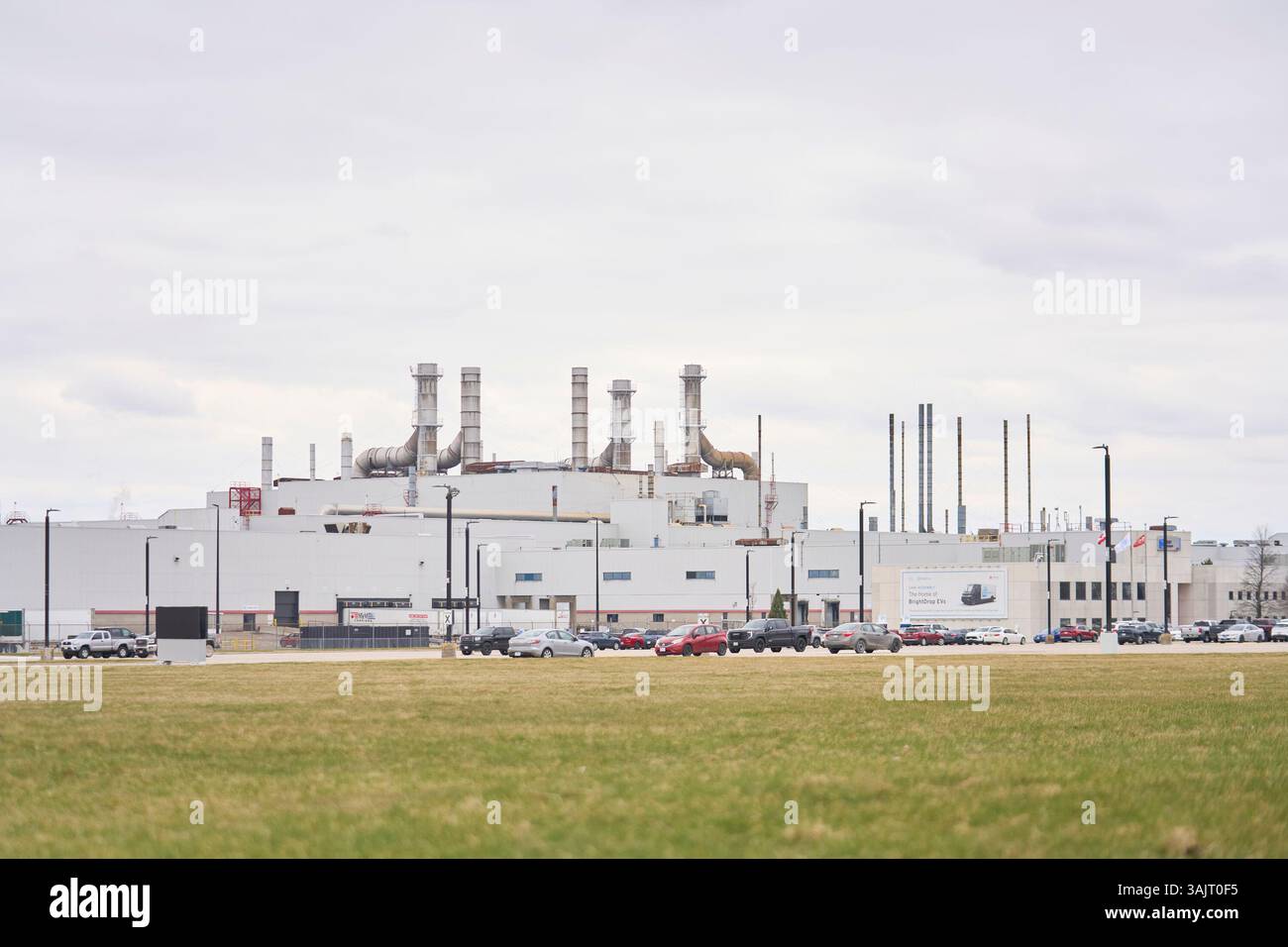 Employees cars sit in the parking lot at GM's Cami Assembly plant in ...