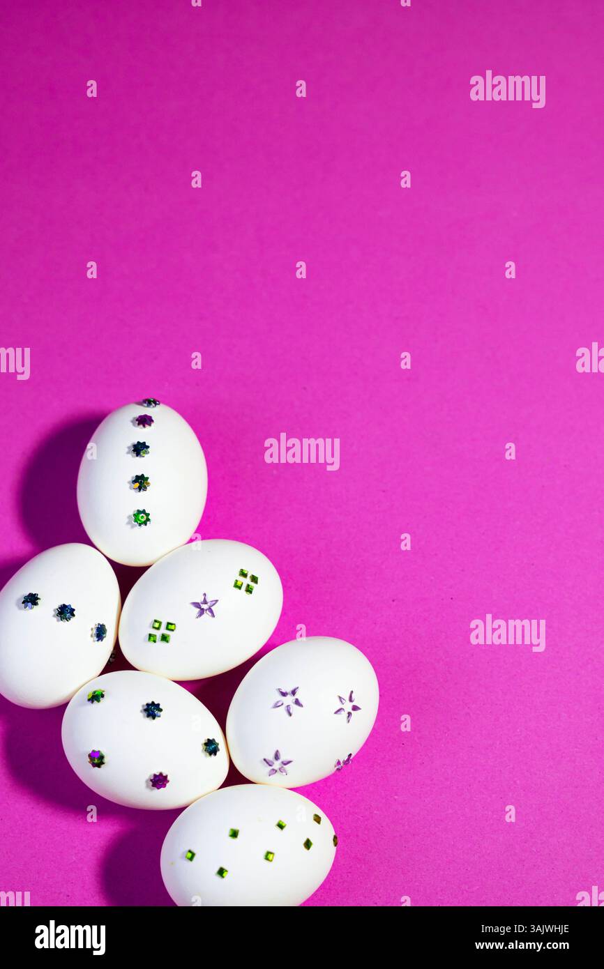 Flat Lay with Decorative White Eggs On light Purple Backkground. Modern festive design with handcrafted egg decorations in a flat layout, perfect for Stock Photo