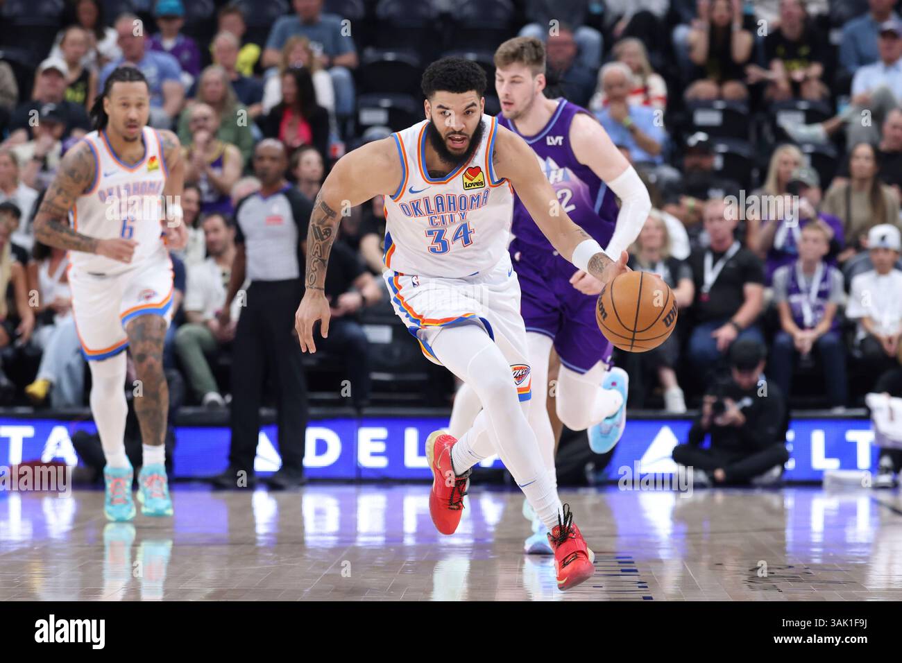 Oklahoma City Thunder forward Kenrich Williams (34) brings the ball ...