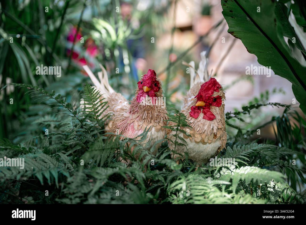 Handmade decorative chicken figure in garden setting. Spring and Easter ...