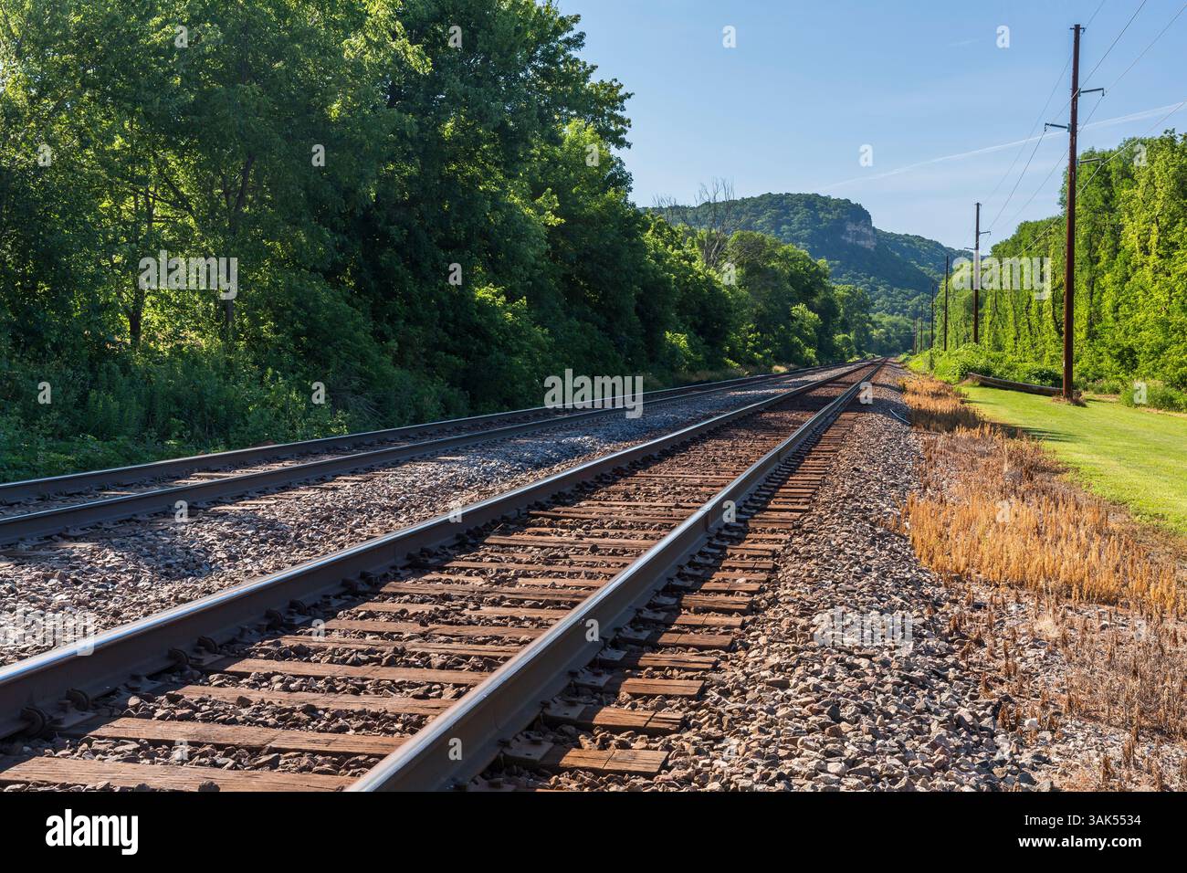 A railroad double track mainline scenic landscape. Stock Photo