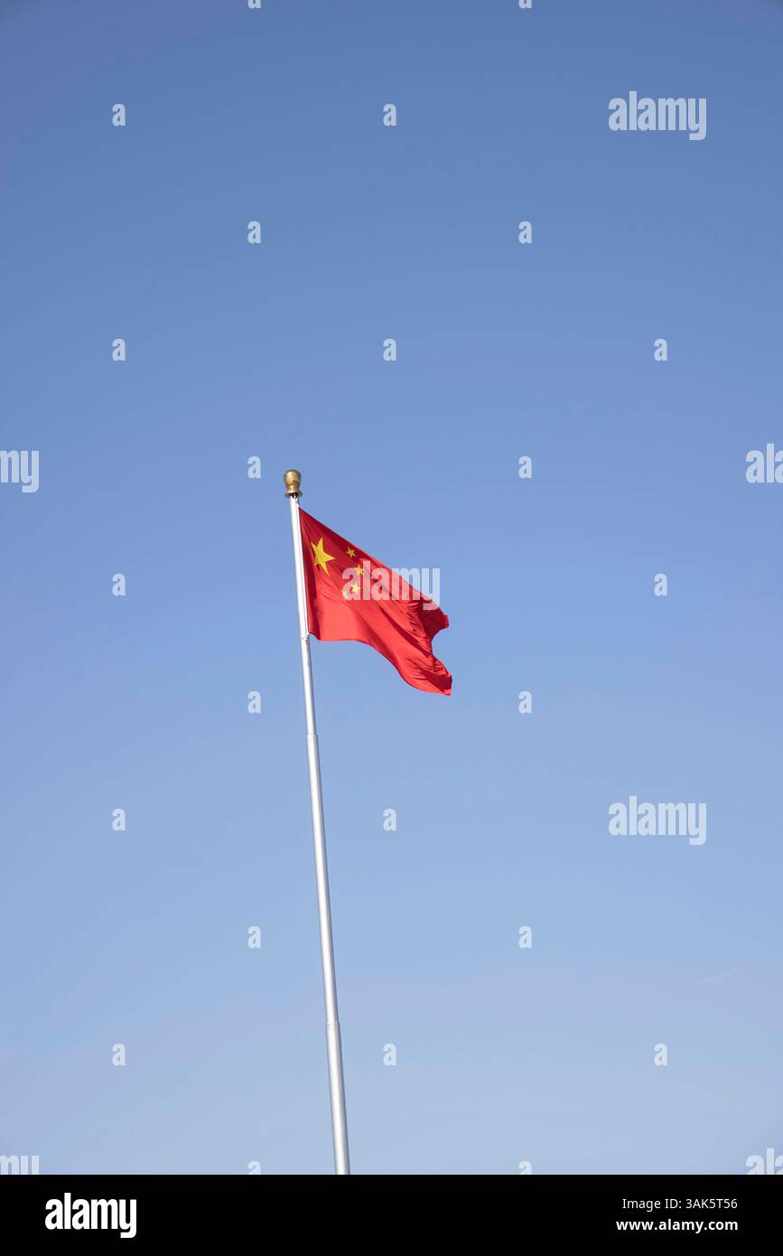 the chinese red flag with 5 stars in beijing china Stock Photo