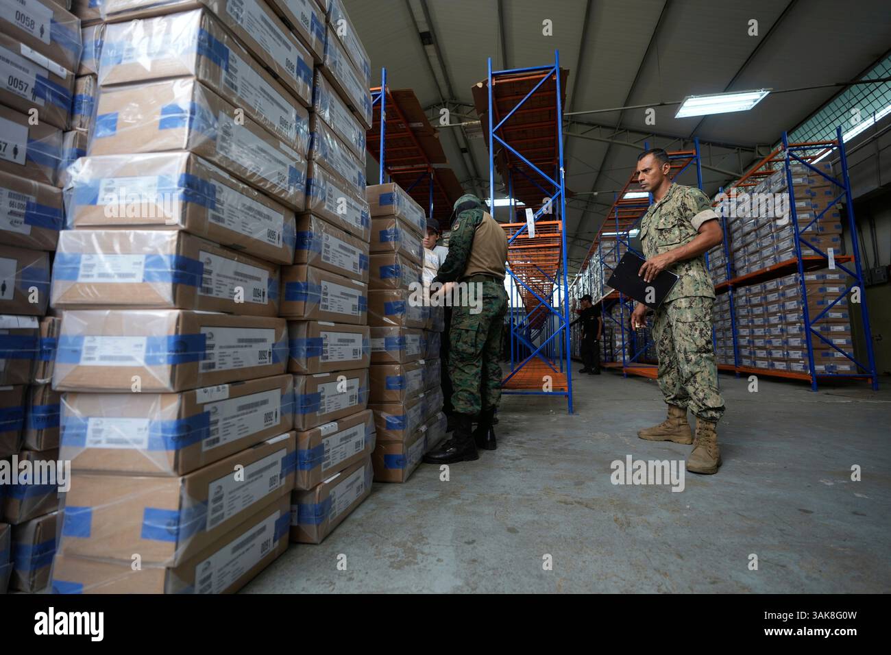 Navy soldiers count boxes of election materials to be taken to a ...