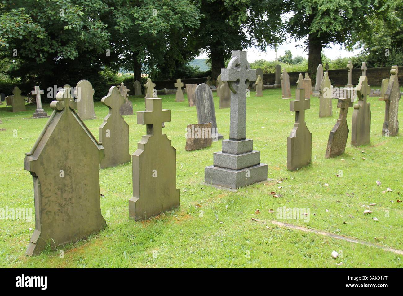 The Stone Headstones of an Old Church Graveyard Stock Photo - Alamy