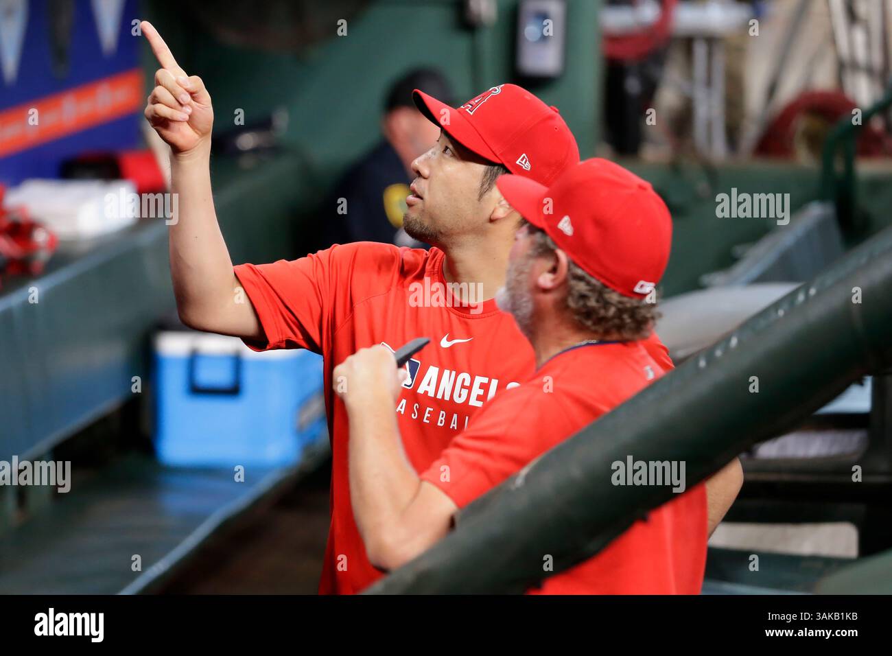 Tim Buss Los Angeles Angels pitcher Yusei Kikuchi, left, talks with coach Tim ...