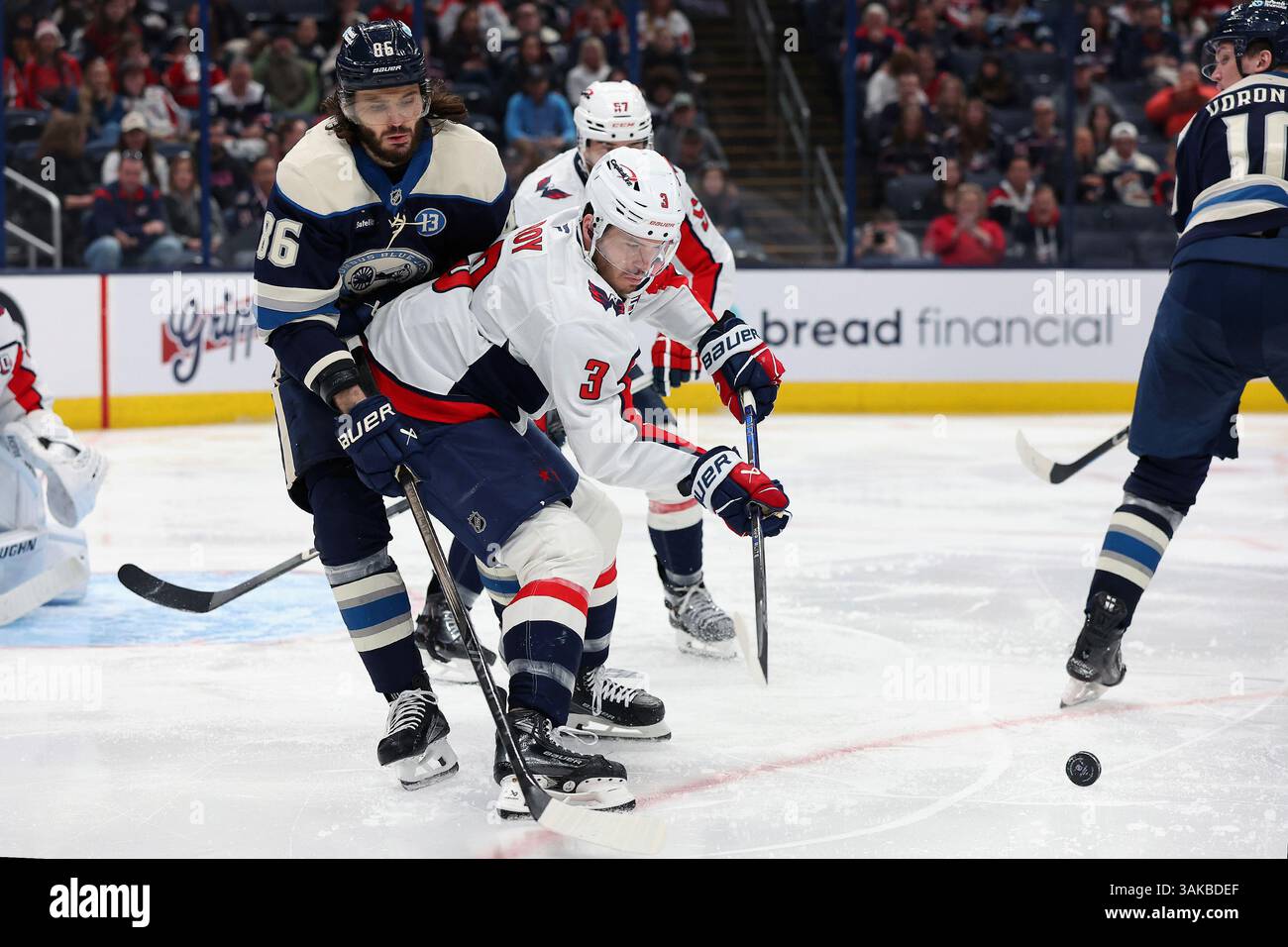 Marchenko 86 Washington Capitals defenseman Matt Roy (3) goes for the loose puck ...