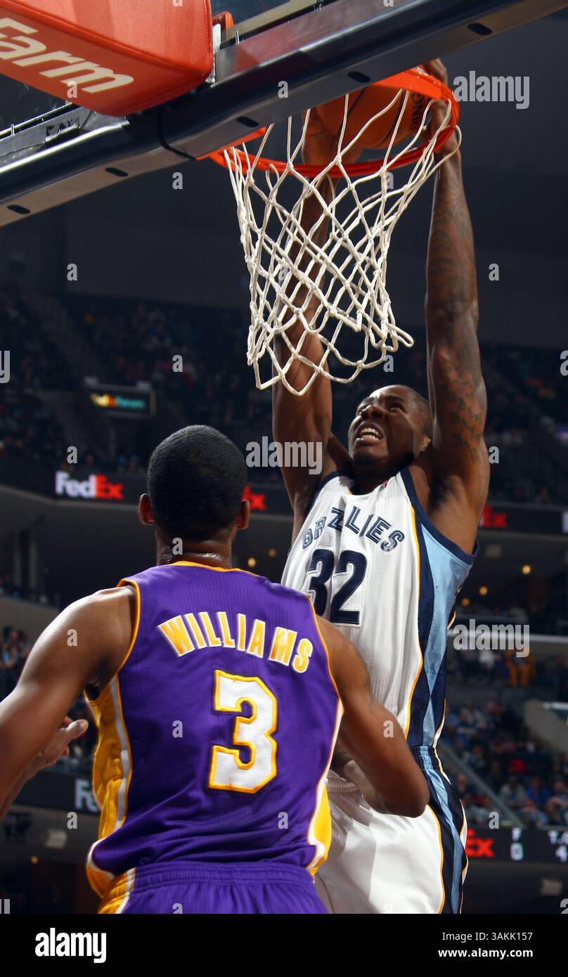 Los Angeles Lakers forward Ed Davis (21) and Detroit Pistons forward Caron  Butler (31) chase a loose ball during the second half of an NBA basketball  game in Auburn Hills, Mich., Tuesday,, image size:808x1390