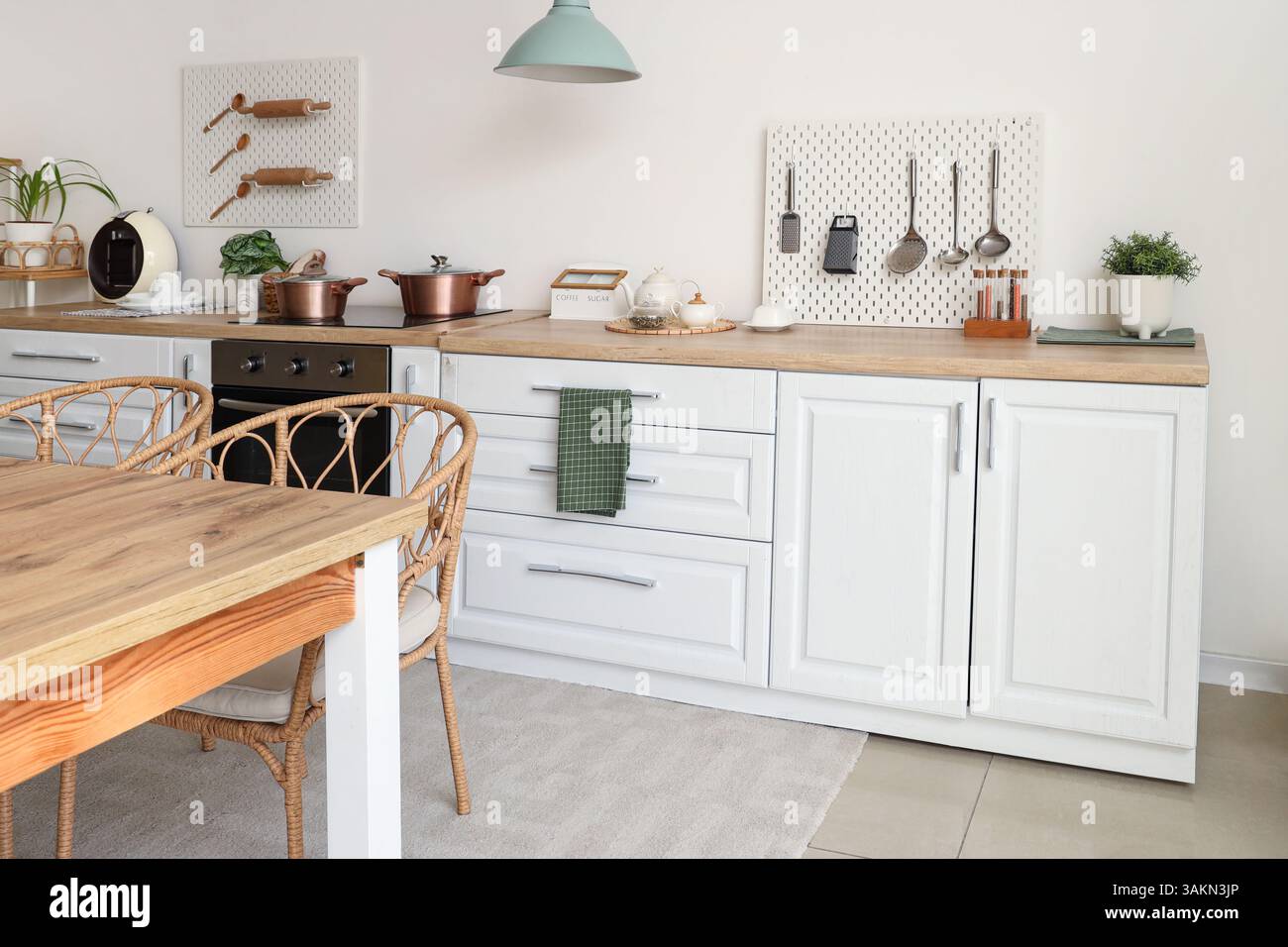 Interior of kitchen with white counter and peg board Stock Photo - Alamy