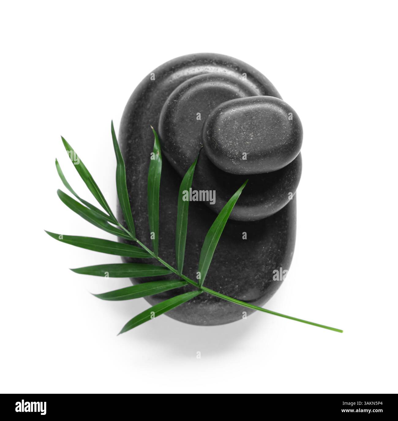 Stack of black spa stones on white background Stock Photo - Alamy