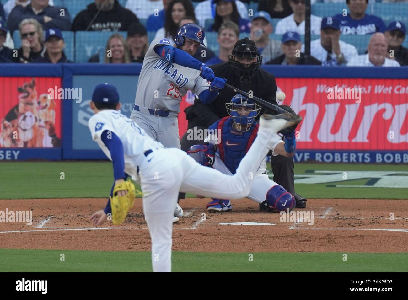 Chicago Cubs' Michael Busch, right hits a solo home run as Los Angeles ...