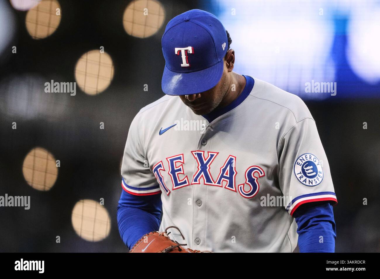 Texas Rangers starting pitcher Kumar Rocker walks back to the dugout ...