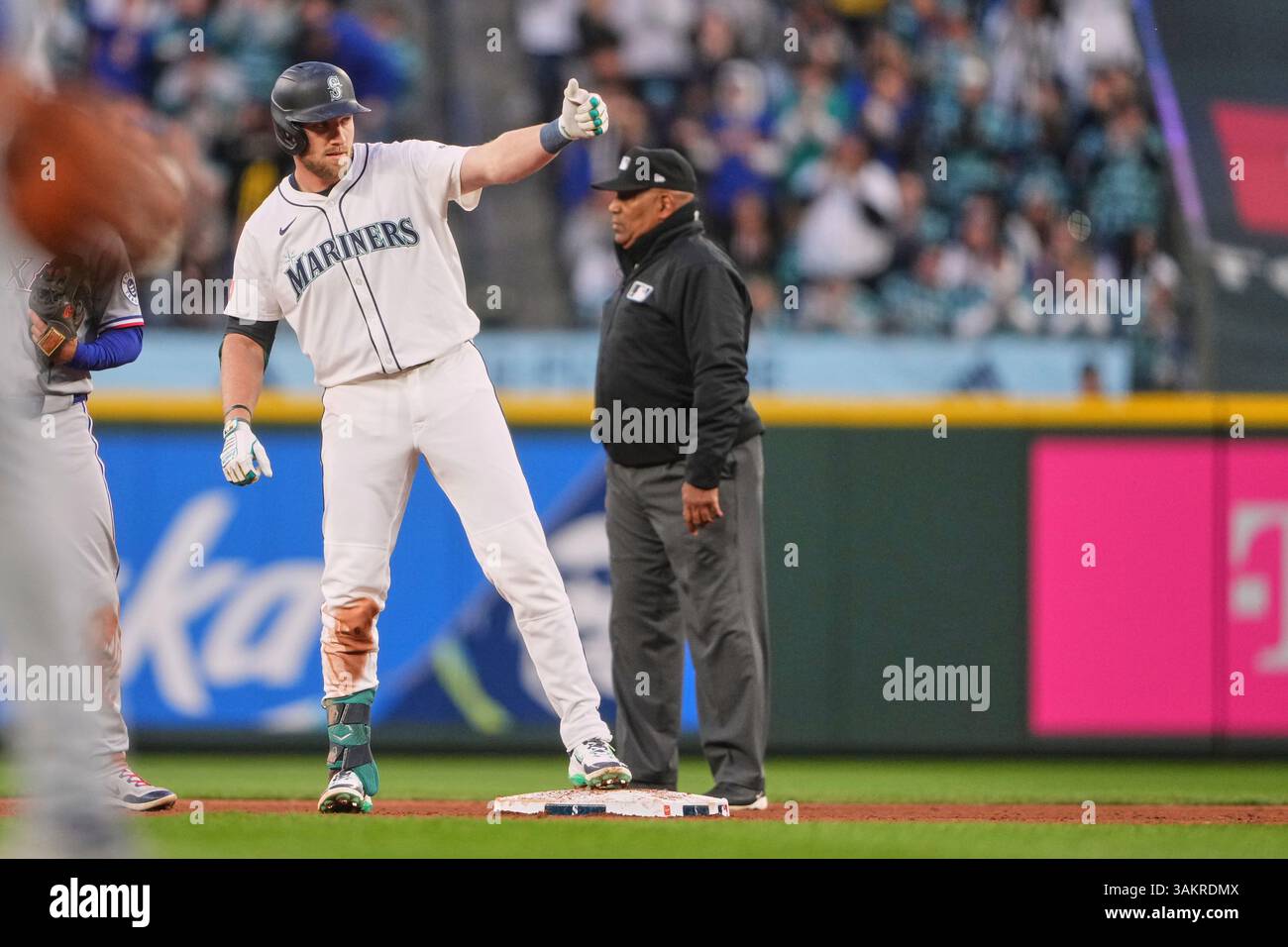 Mariners Luke Raley Seattle Mariners' Luke Raley reacts to hitting an RBI double to score ...