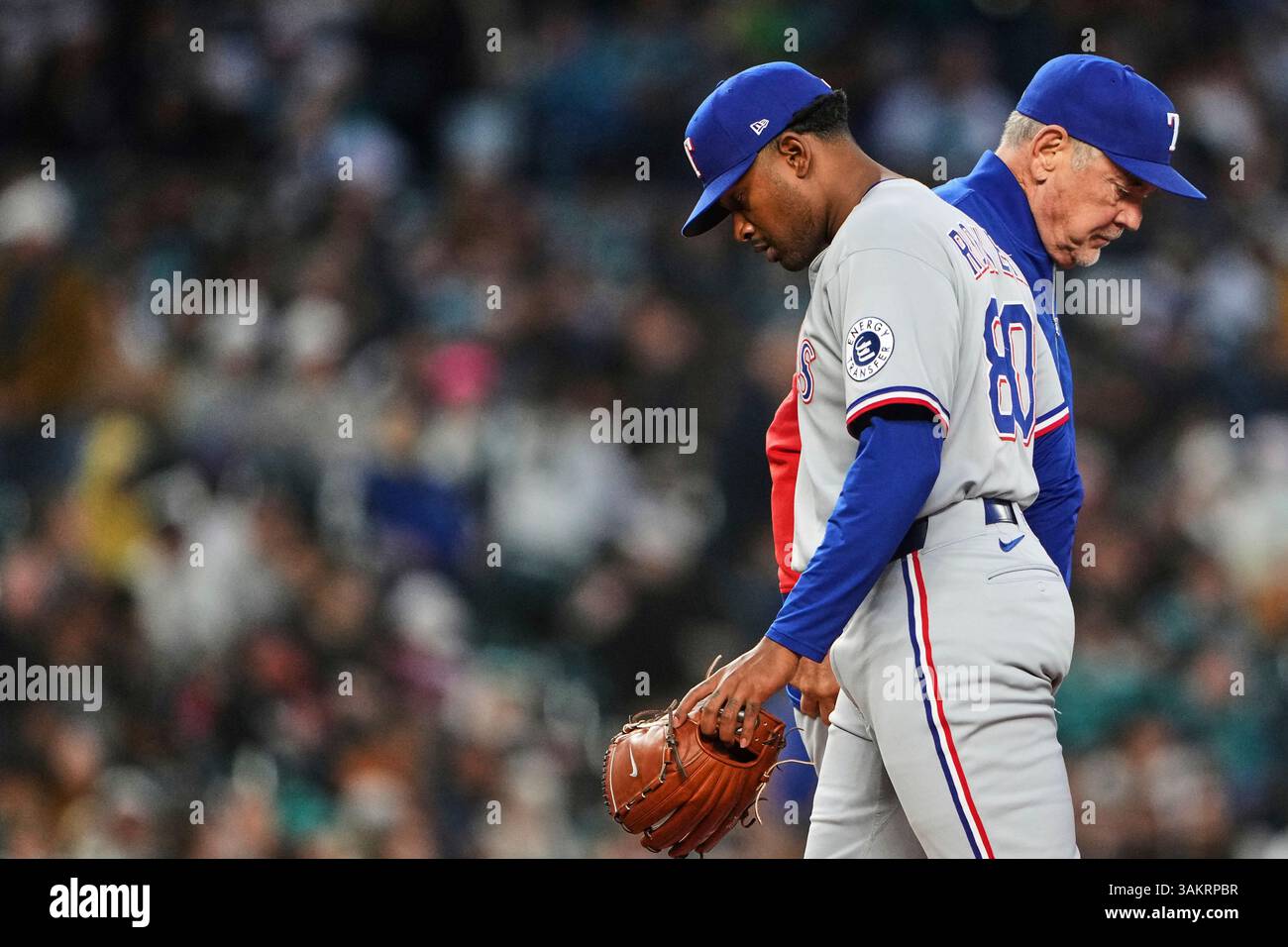 Texas Rangers starting pitcher Kumar Rocker, left, is pulled from the ...