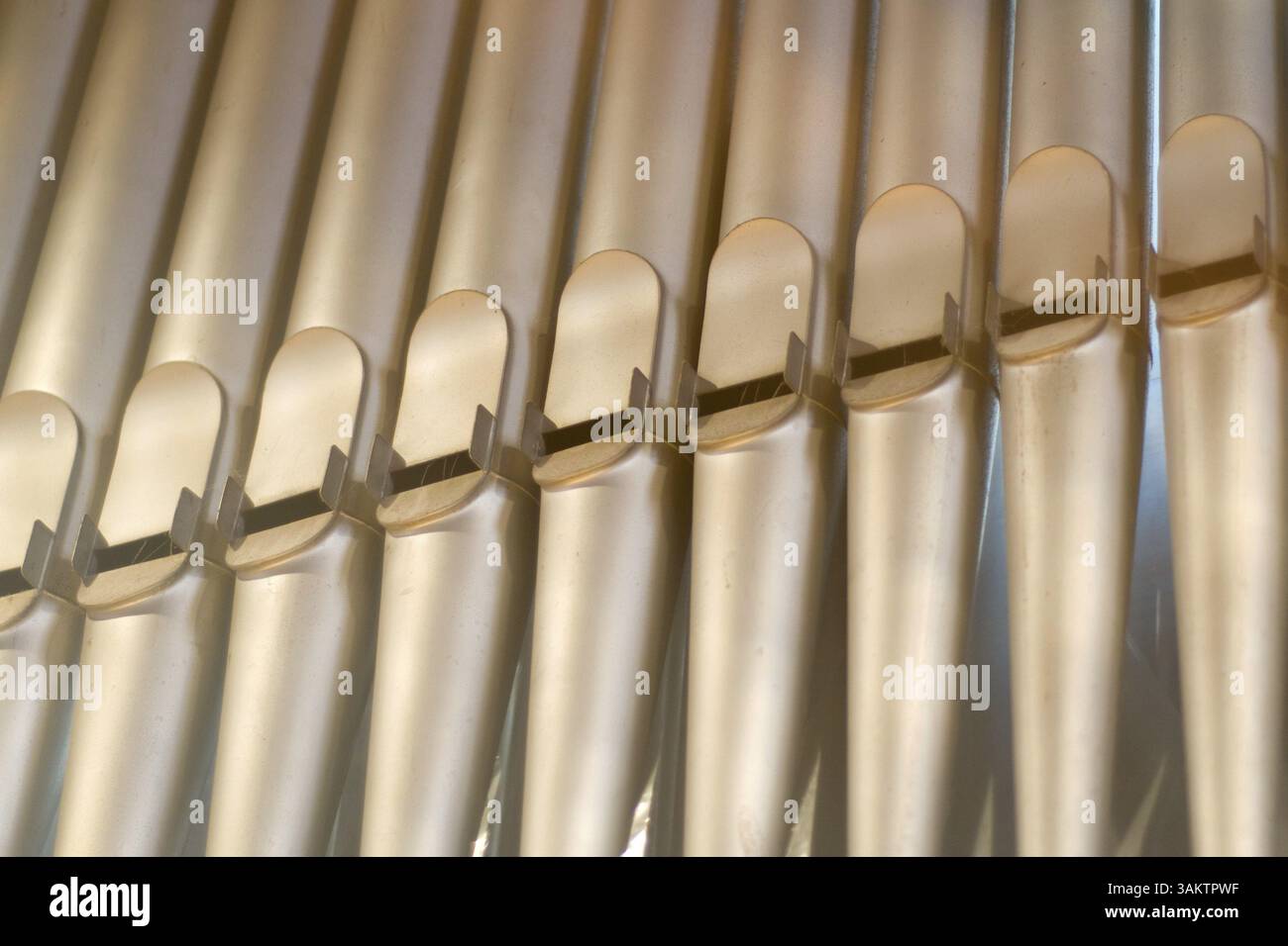 Copper organ pipes for music in the church Stock Photo