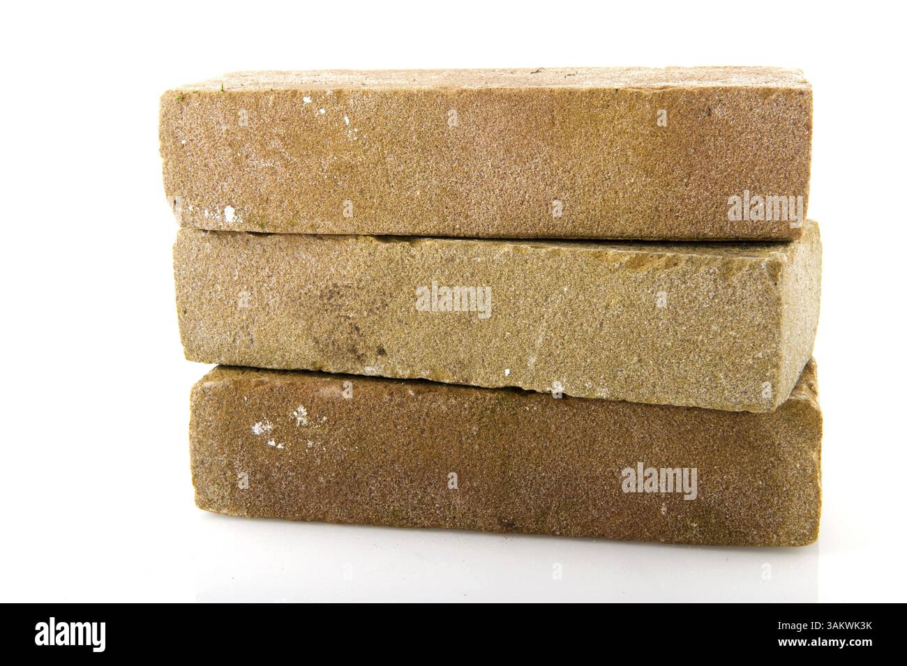 Three stacked bricks to build a house or wall Stock Photo